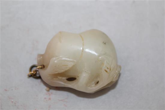 A Chinese whiteish grey jade carving of a peach branch sprig, 19th century, 4.2cm